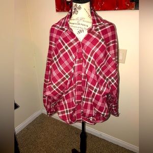 Cute over sized plaid shirt with collard neck, dropped shoulders and knot front